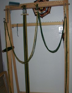 finishing attaching the warp to the bottom beam