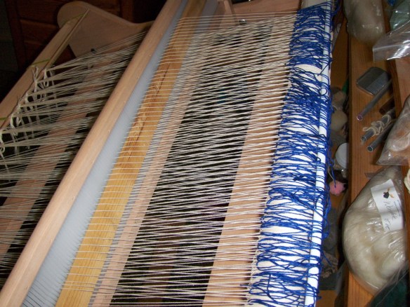 reed sleyed - blue heddles on