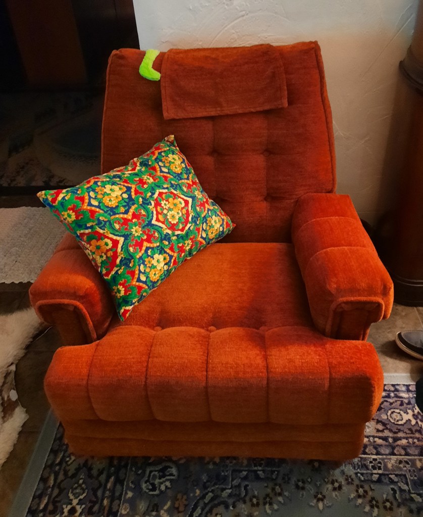 The finished homemade wool pillow with a zipped cover made with vintage Alexander Henry designer fabric