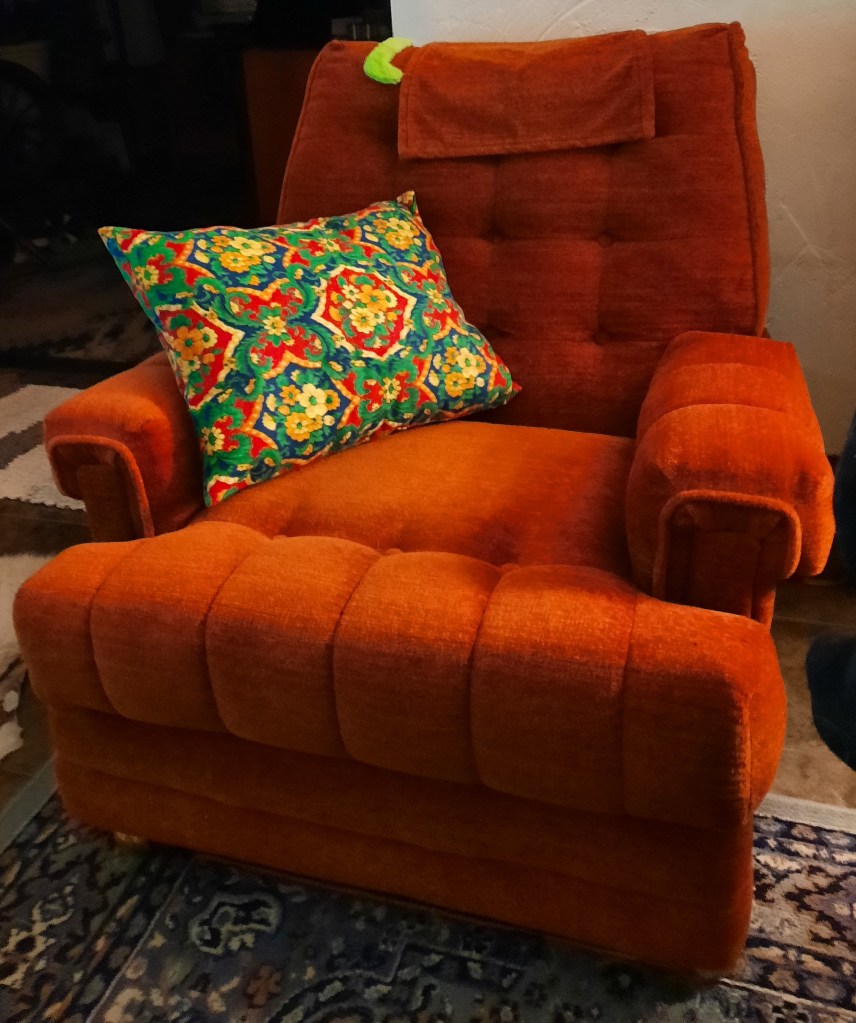 The finished homemade wool pillow with a zipped cover made with vintage Alexander Henry designer fabric